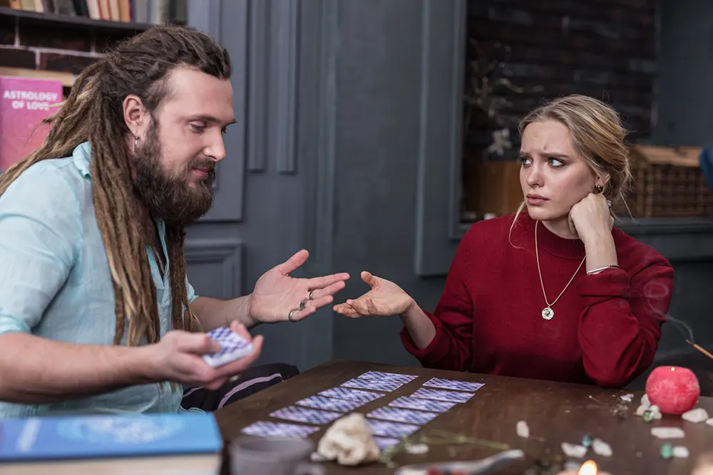 Understanding the Role of the Querent in a Tarot Session 4 Person asking thoughtful questions as querent in tarot reading for personalized advice